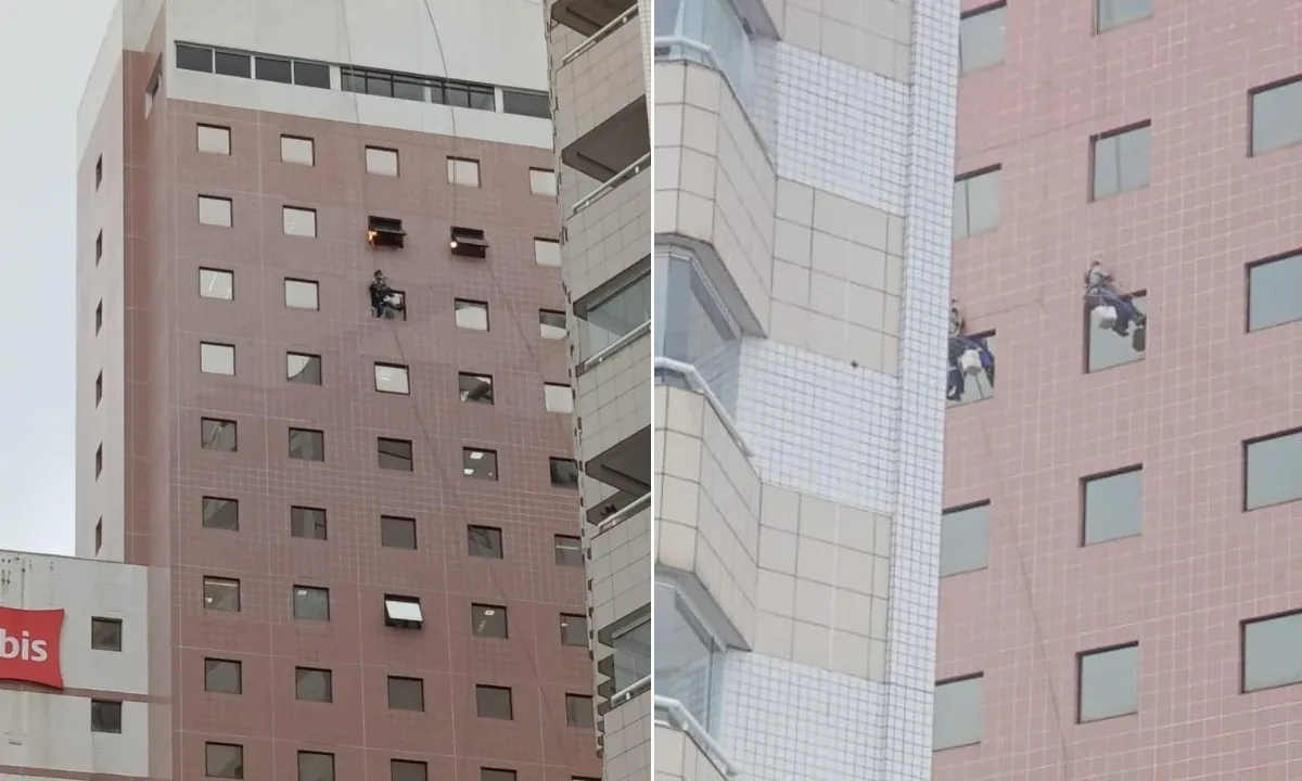 Trabalhadores ficam pendurados em fachada de hotel durante ventania no litoral de SP; VEJA